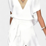 Elena – Vestido Blanco Cruzado con Detalles Elegantes y Frescos